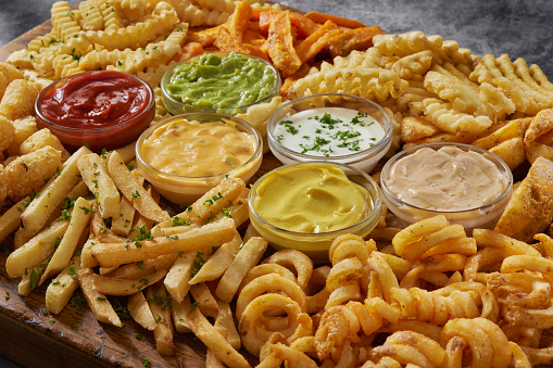 The Ultimate French Fry Board with Curly Fries, Potato Gems, Crinkle Cut, Steak Fries, Take Out Fries, Sweet Potato and Waffle Cut  Fries with Dipping Sauce's