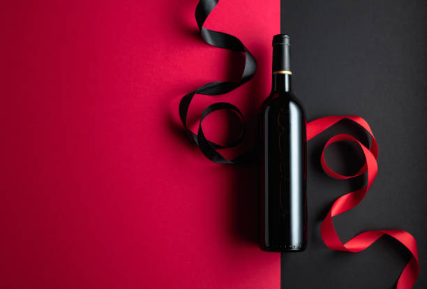 istock Bottle of red wine with satin ribbons. 1479143193