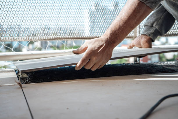istock Mason laying a tile in the space prepared in the floor. I work in a construction. 1479145445