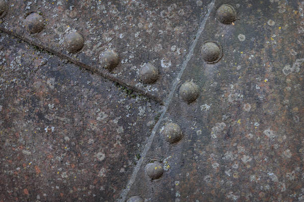 istock Rusty sheets of metal fastened with large rivets. 1479146665