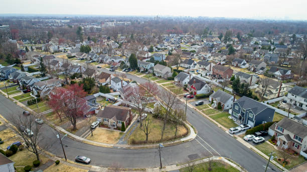 istock Middle Class Neighborhood flyover NYC in the far right background 1479149264