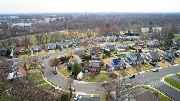 istock Middle Class Neighborhood flyover NYC in the far skyline 1479149396