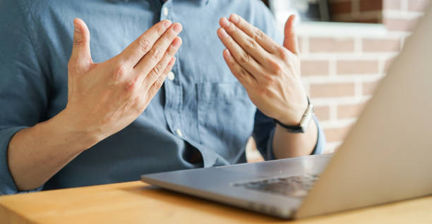 istock close up man hand gesture about happy sign language to teaching or learning from webinar in home for lifestyle concept 1479150462