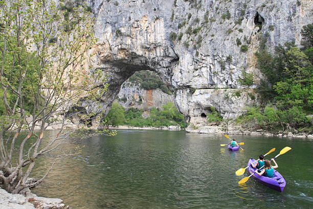 kayaking in pont d'arc (ardeche, france) kayaking in pont d'arc (ardeche, france) sand river stock pictures, royalty-free photos & images