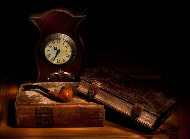 istock pipe, old books and watch 147915449