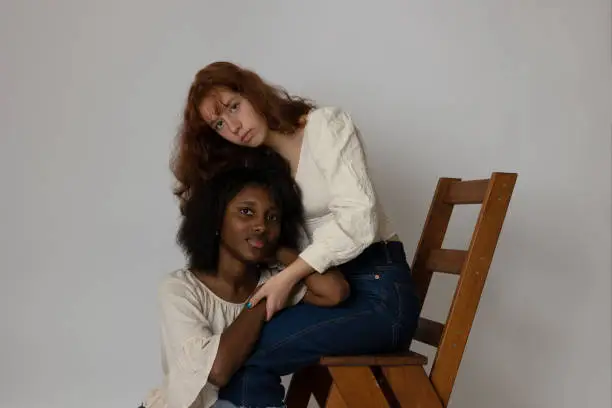 Black and brunette young women portrait showing diversity. Generation Z