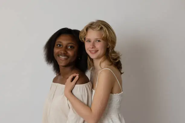 Black and blonde young women portrait showing diversity. Generation Z