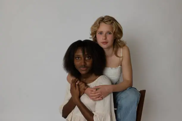 Black and blonde young women portrait showing diversity. Generation Z