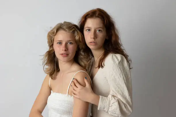 Blonde and brunette young women portrait showing diversity. Generation Z