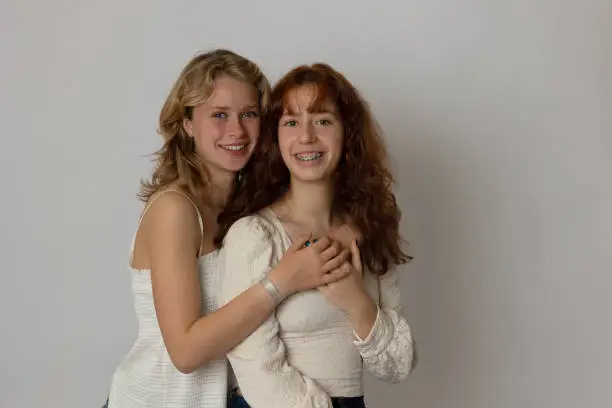 Blonde and brunette young women portrait showing diversity. Generation Z