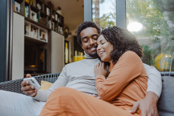 istock Happy young African American couple using smart phone 1479156835