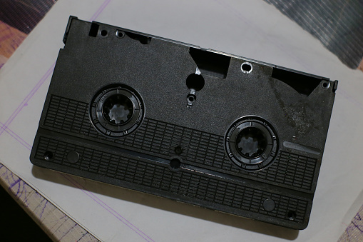 The source of entertainment is an old video cassette reel.