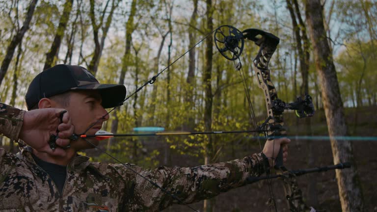 Archery Hunter fires compound bow