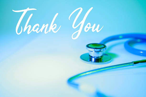 'Thank you!' written on a blue abstract stethoscope background. Healthcare concept.