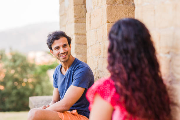 istock Multiethnic middle aged couple talking and laughing happy conversation. Diversity 1479168700