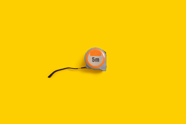 istock Construction tape measure on a yellow background. Top view, flat lay 1479169066