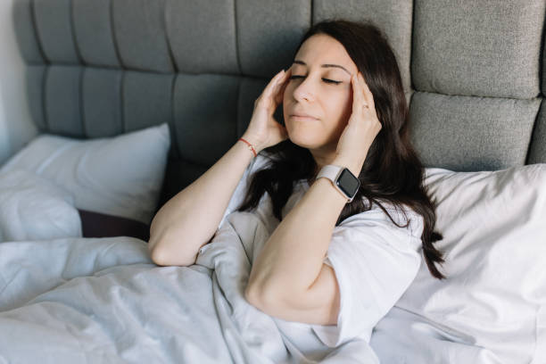 istock Woman having headache when wake up 1479169761