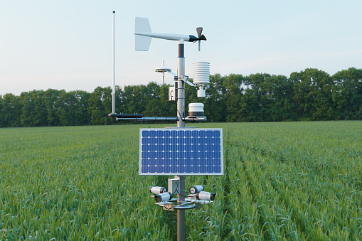 Weather station in grass field, 5G technology with smart farming concept