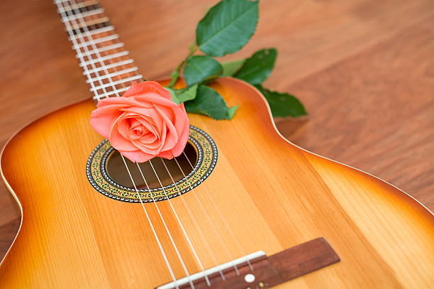 istock Guitar and rose on a floor. 147917392