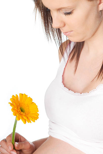 istock pregnant girl with flower 147917400