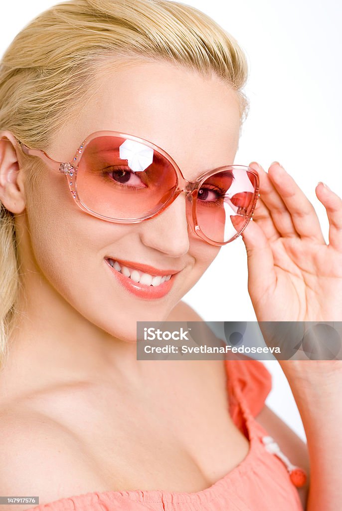 La mujer en rosa gafas de sol - Foto de stock de Resplandeciente libre de derechos