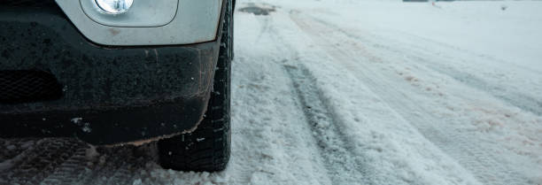 istock car tires in winter road 1479177186