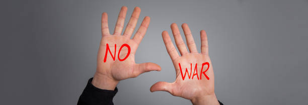 istock hand of a man with the text no war 1479177201