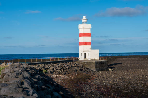 The old Garðskagi Lighthouse at Reykjanes peninsula in Iceland stock photo