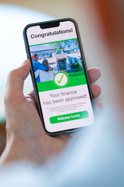 istock Man looking at a mortgage loan application approval on a mobile phone. 1479184866