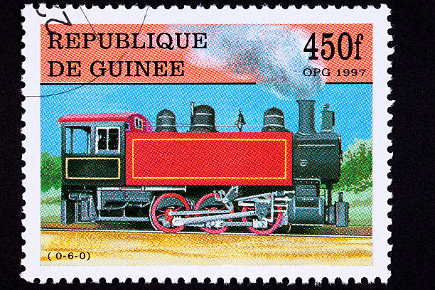 istock Canceled Guinea Train Postage Stamp Old Railroad Steam Engine Locomotive 147918573