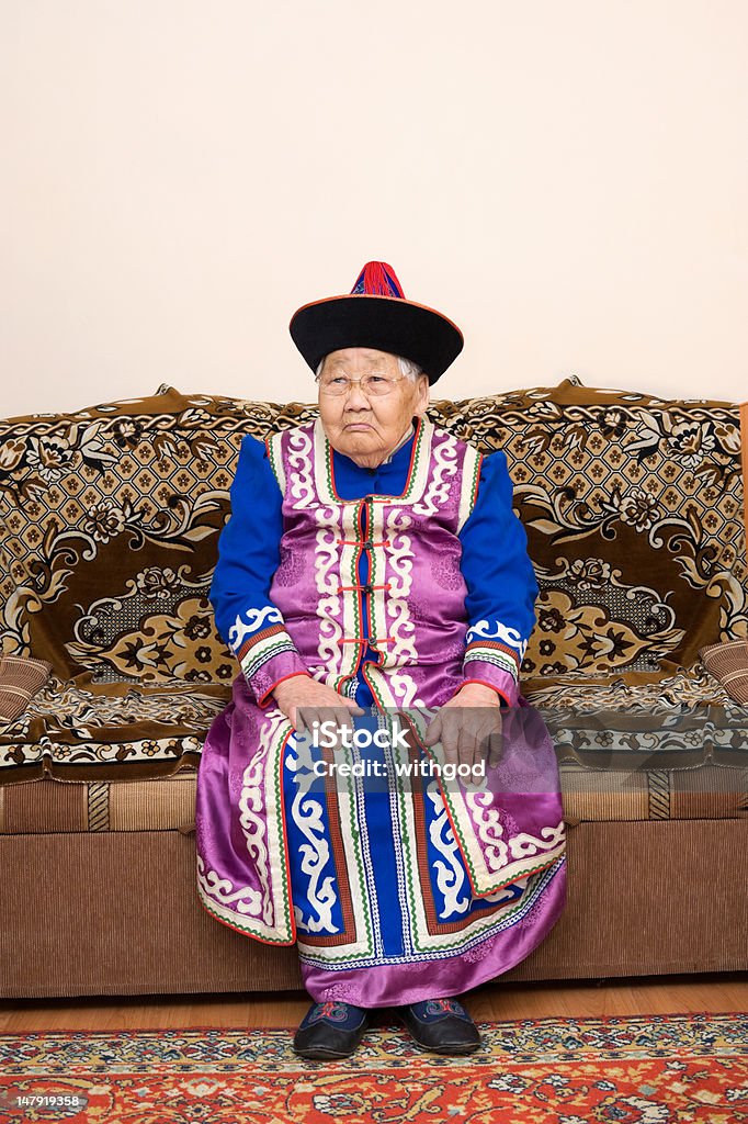 ninety year old asian woman an elderly buryat (mongolian) woman of ninety years, in a national costume 80-89 Years Stock Photo