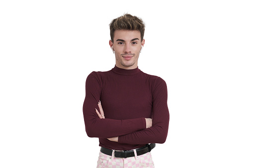 Young caucasian man smiling with his arms crossed and earphones, isolated on white background.