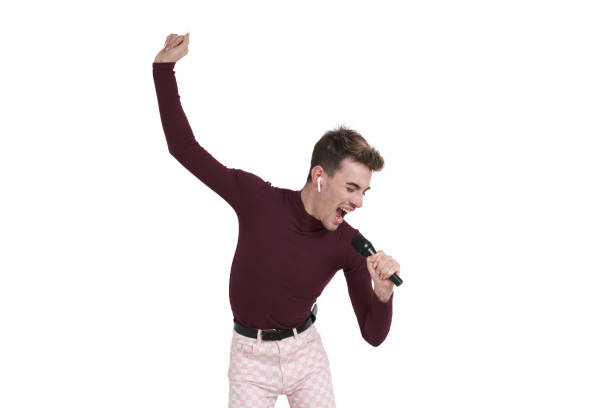 istock Young caucasian man singing with a microphone, isolated. 1479199591