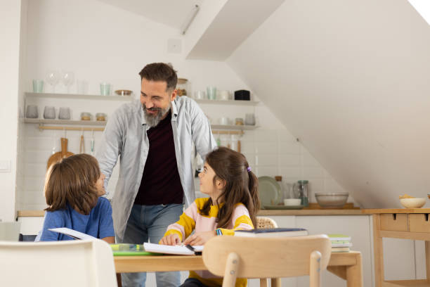 istock Father homeschooling his adopted children 1479200111