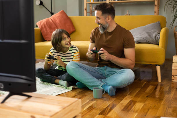 istock Boy and his dad gaming and having fun at home 1479200203