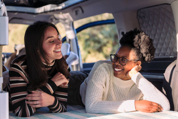 istock two young women enjoying van life relaxation 1479201438