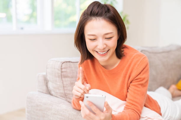 istock attractive Asian woman using a smart phone 1479201542