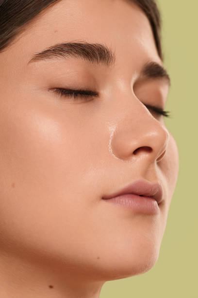 istock Young female face with closed eyes 1479201555