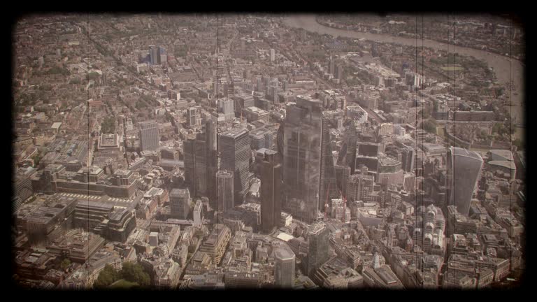 Old Film Aerial View of The City and the River Thames, London, UK. 4K