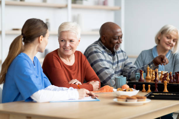 istock Nurse having conversation with attractive senior woman 1479214738