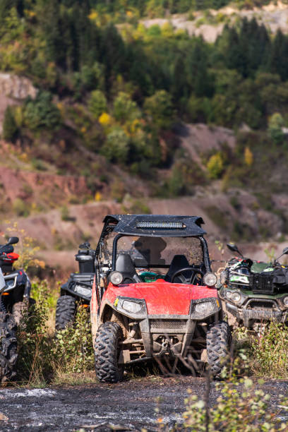 istock Various ATV quad motors in the forest area ready for adventurous driving 1479221053
