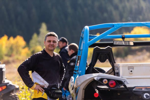 istock A man in a forest posing next to a quad and preparing for ride 1479224414