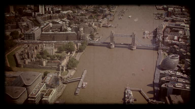 Old Film Aerial View of Tower Bridge and the Tower Of London, London, UK. 4K