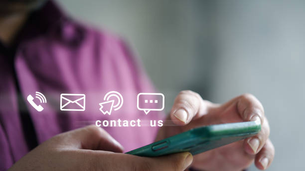 istock Businessman using pointing touching smart phone with call phone, email, address and chat message icons 1479229447
