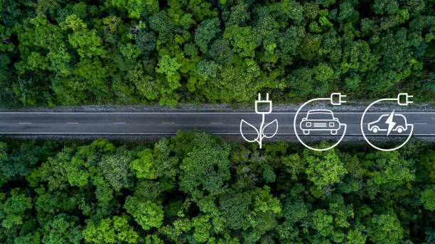 istock Electric vehicle car going through forest, EV electrical energy for environment, Nature power technology sustainable devlopment goals green energy, Ecosystem ecology healthy environment road trip 1479241259