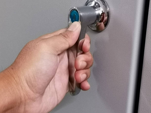 istock Close up photo of door handle with key on low voltage switchboard. 1479241885