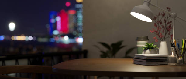 istock Close-up image of a copy space on a wooden table in modern dark office. 1479245598