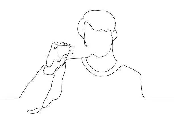 Vector illustration of continuous line drawing silhouette of a young man showing a business card. A businessman or freelancer offers his services with a contact card