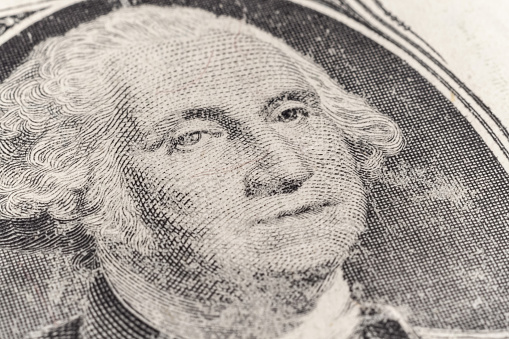 worn out one dollar bill closeup. fragment macro Portrait of President George Washington