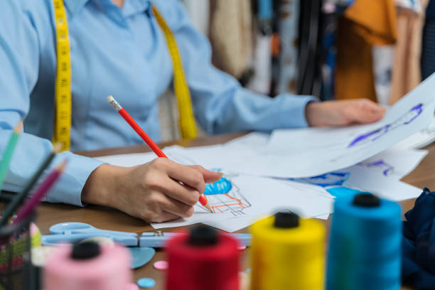 istock The tailor is working at his best.sketch clothes with laptop computer design to customer,occupation owner small business 1479256757